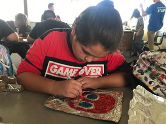 Student working on an art activity