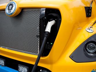 Electric Bus plugged in front view 