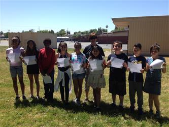 Kohler Safe School Ambassadors holding their certificates