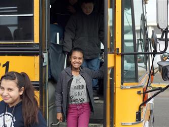 A student getting out of a schoolbus