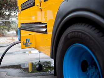 Electric bus plug in on side of bus 