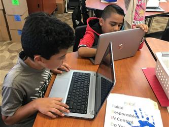 Students completing homework assignments