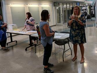 Teresa Rowan helps a new teacher